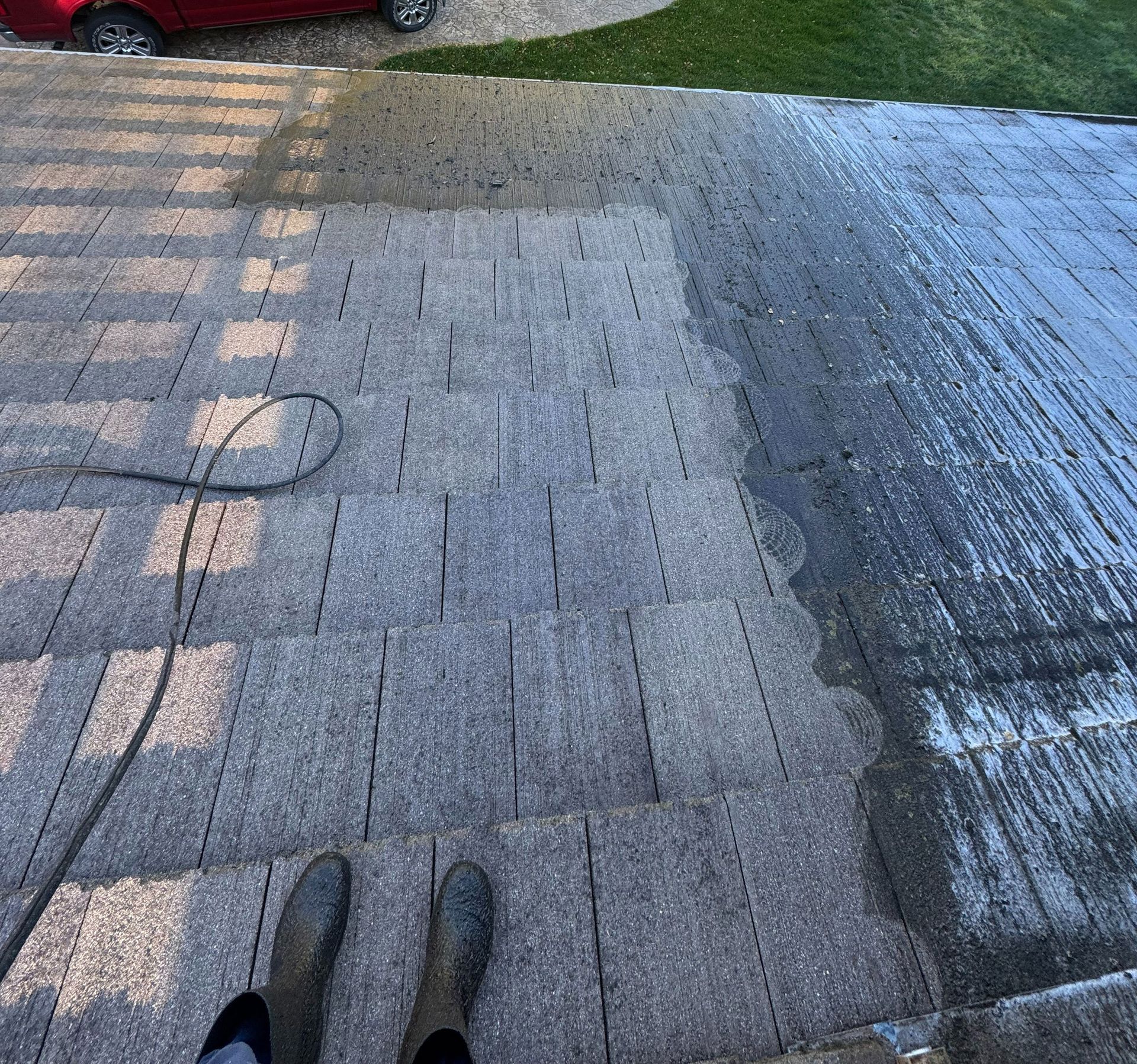 Before and after view of a residential roof cleaning by All One Solar Shine
