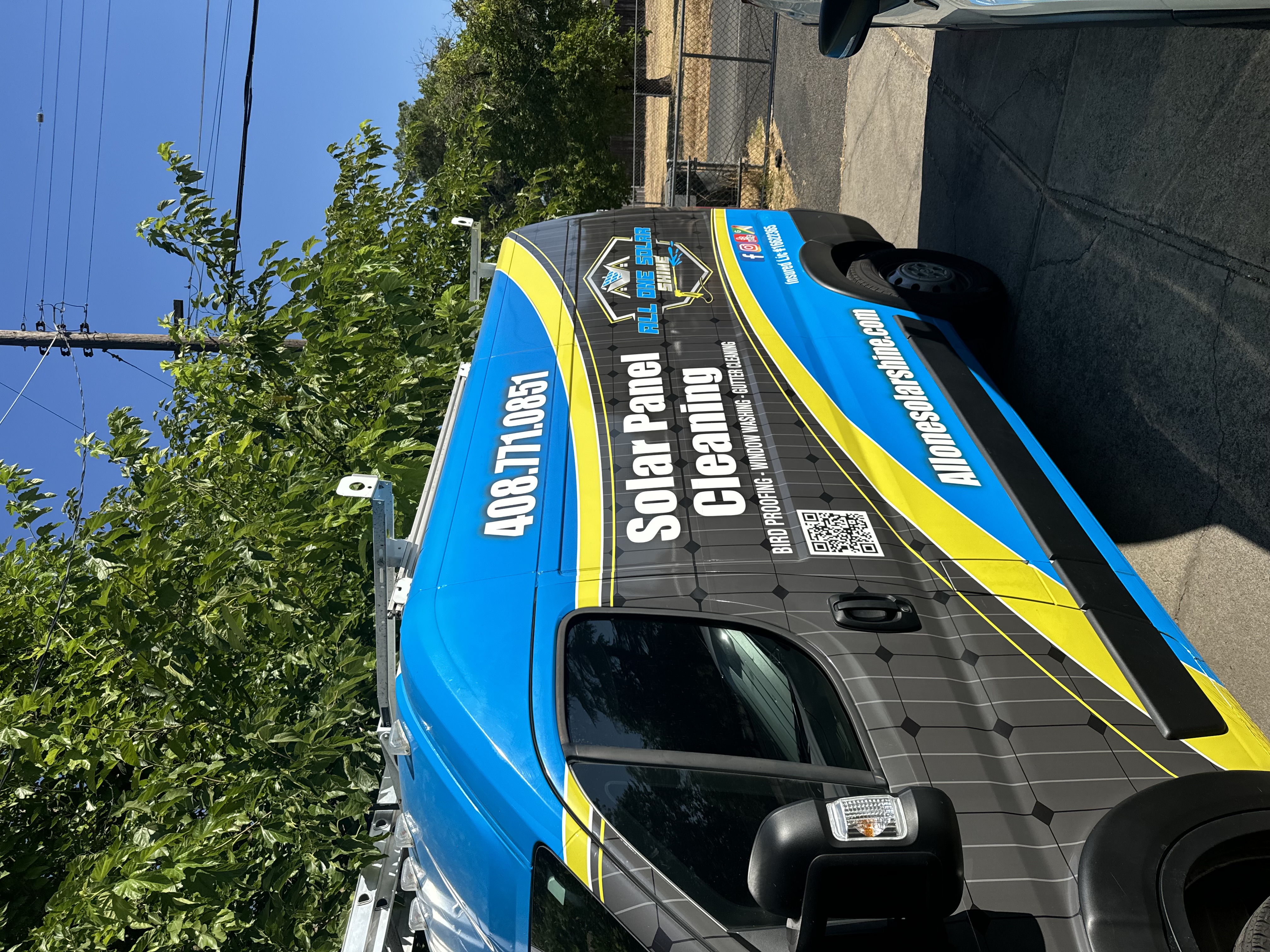 All One Solar Shine service van on a residential street